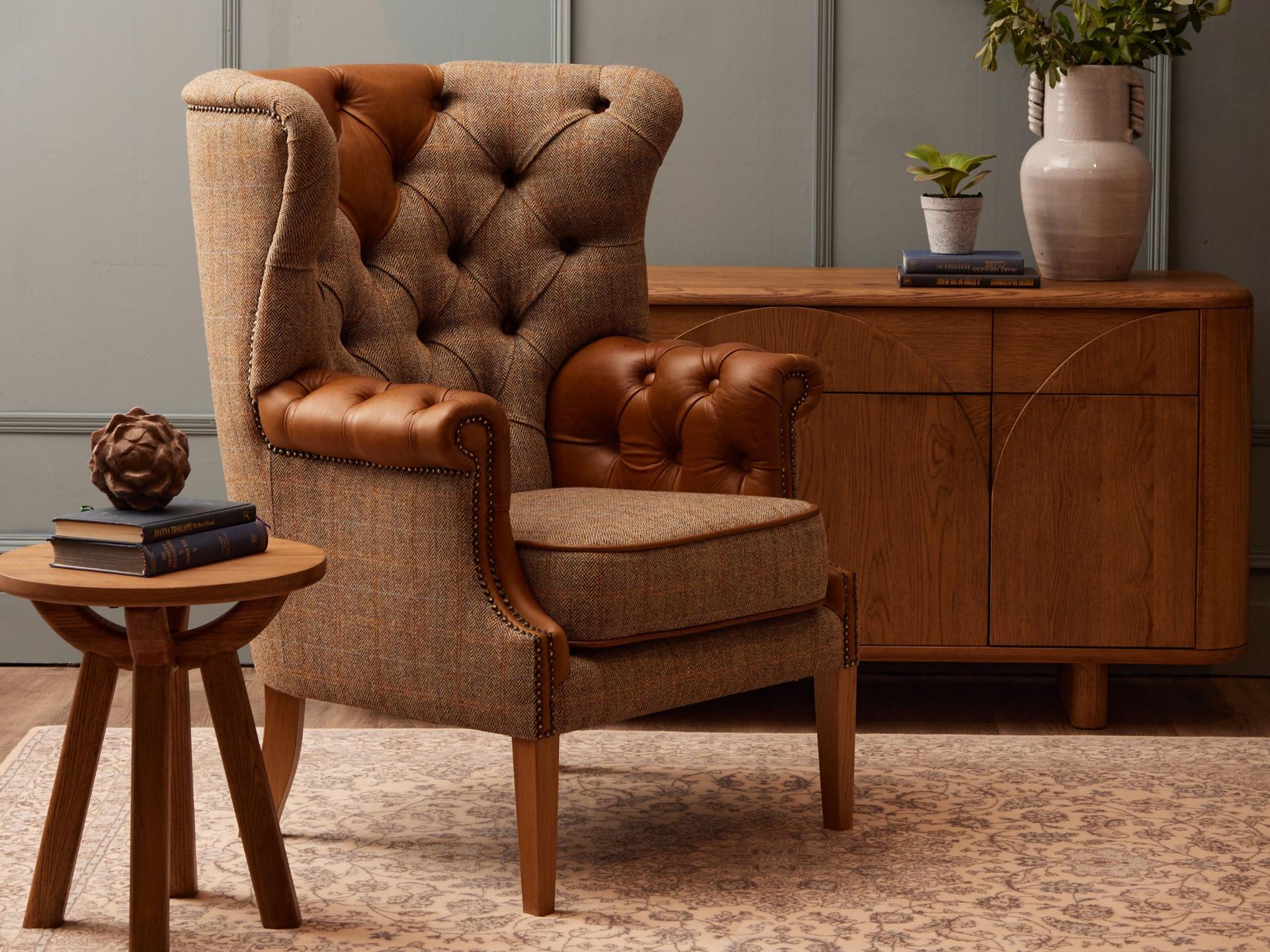 Armchair with fabric seat and leather arms