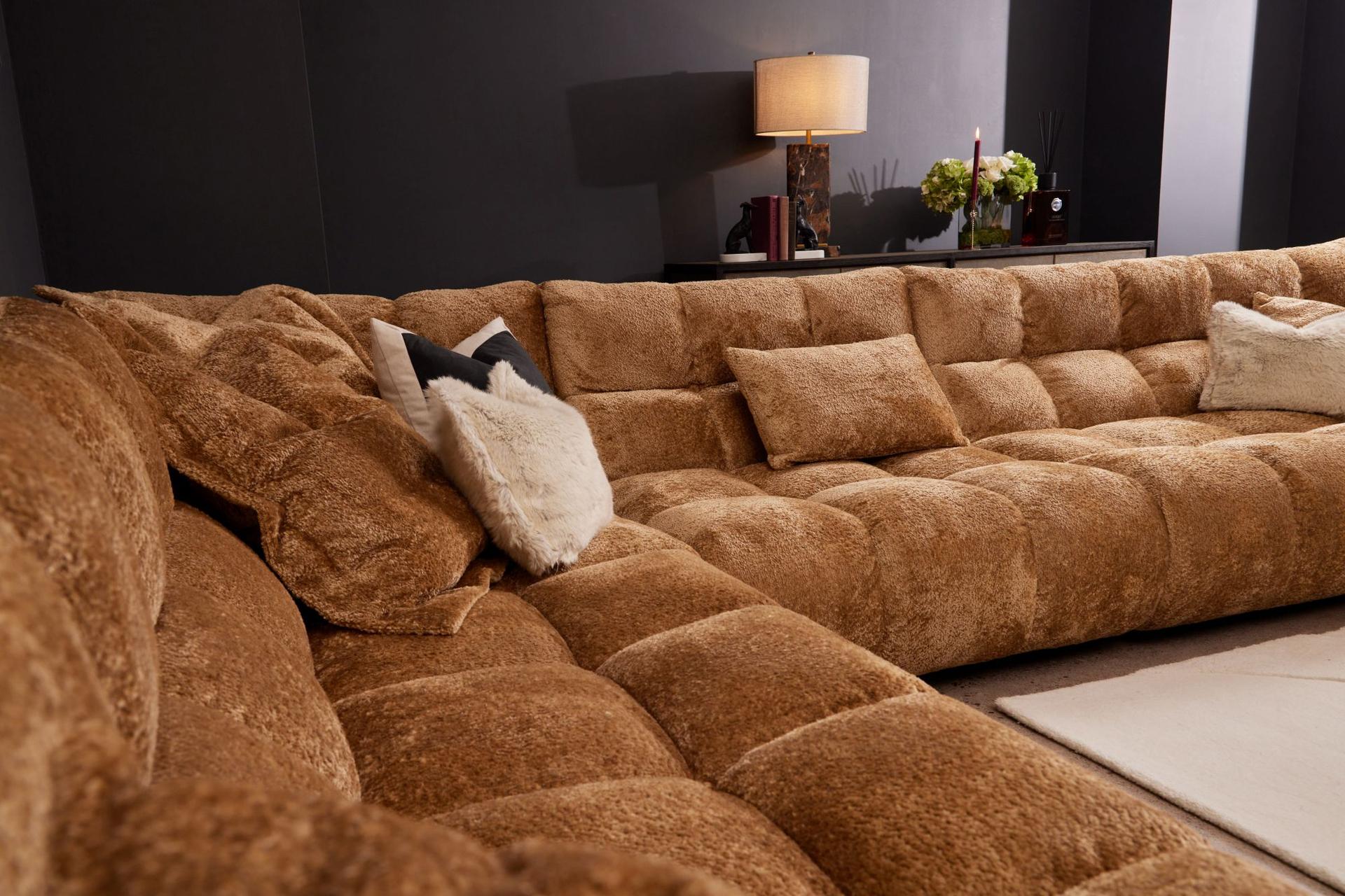 Gracelyn corner modular sofa in Shaun Old Gold fabric, with plush tufted cushions and a modern, elegant silhouette in a living room.