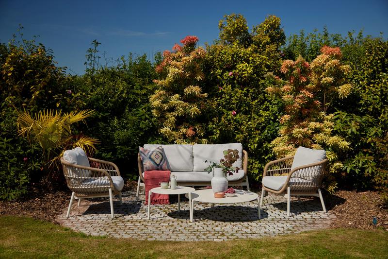Irvington Garden Lounge Set in wicker and aluminium with plush cushions, perfect for stylish outdoor spring and summer living.