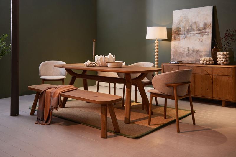 Solid oak Mason Dining Table (seats 6-8) with rustic hue and natural wood grain in a warm, sophisticated dining room setting