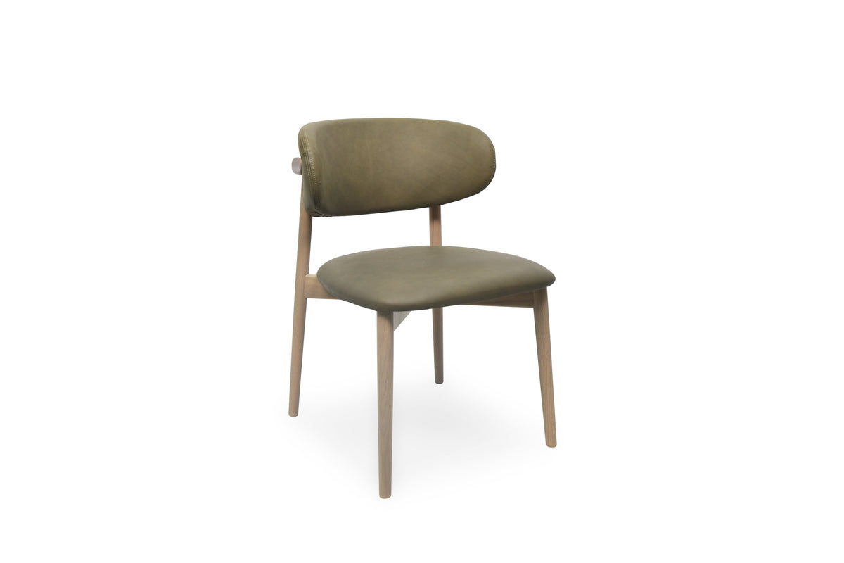 A modern dining chair with olive green upholstered seat and backrest, supported by light natural wood legs, shown against a plain white background.