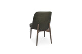 An upholstered dining chair shown from the back, featuring dark olive green fabric upholstery and a medium brown wooden frame with tapered legs, set against a plain white background.