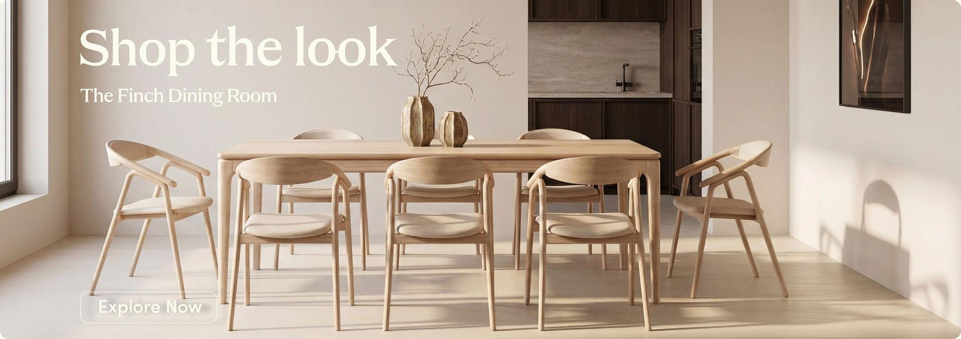 A dining room scene showing a light wood rectangular table surrounded by six matching wooden chairs, with decorative vases on top. Large text at the top reads 'Shop the look' and 'The Finch Dining Room,' suggesting a furniture product listing in a styled interior setting.